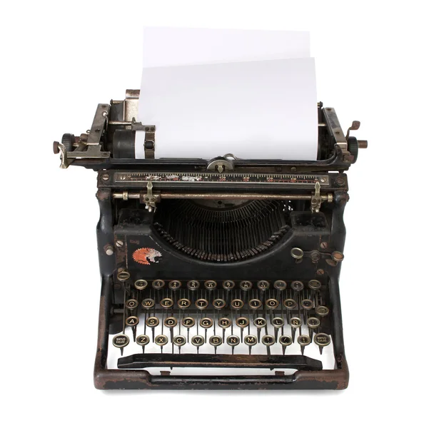 Oude schrijfmachine met een blanco papier — Stockfoto