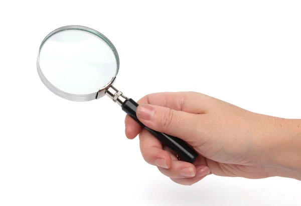 Hand holding a magnifying glass — Stock Photo, Image