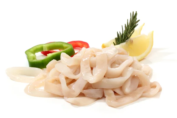 stock image Pile of raw squid rings over white