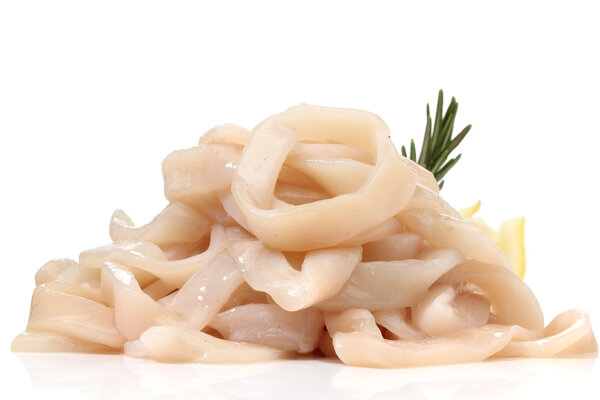 Pile of raw squid rings over white