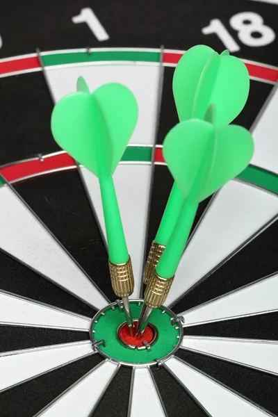 Dartboard bull´s eye. Three darts on center — Stock Photo, Image