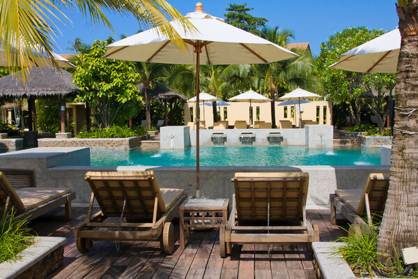 Chaise lounges and swimming pool