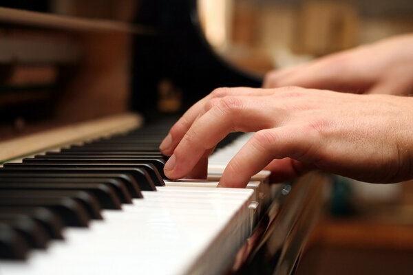 Hands of a piano playing guy