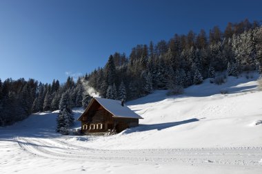 Log cabin in winter clipart