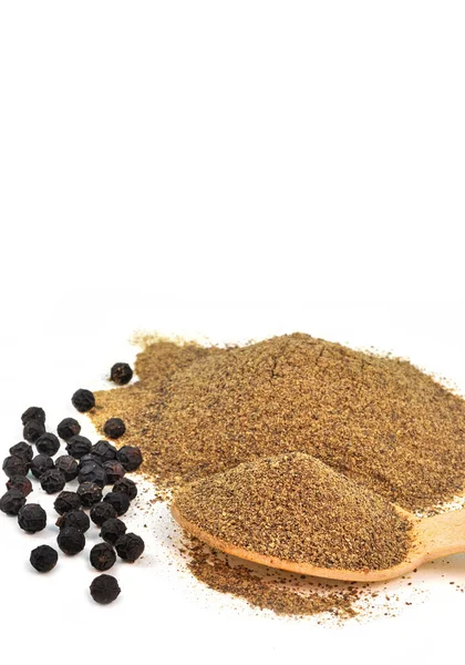 Whole and powdered black pepper — Stock Photo, Image