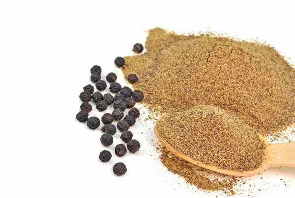 Whole and powdered black pepper — Stock Photo, Image
