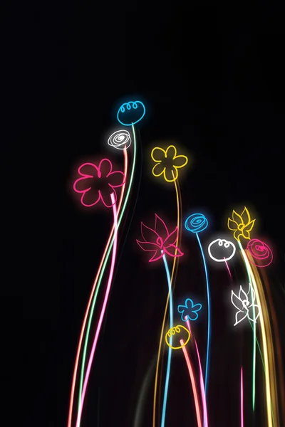 stock image Neon flowers on a black background