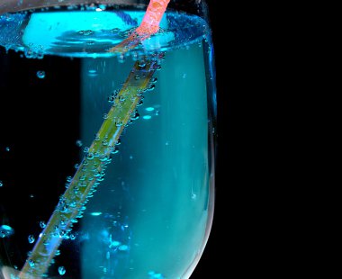 Blue cocktail with a straw in bottles clipart