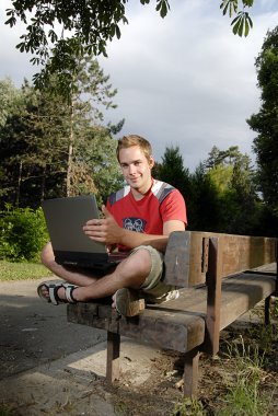 Young man with notebook clipart