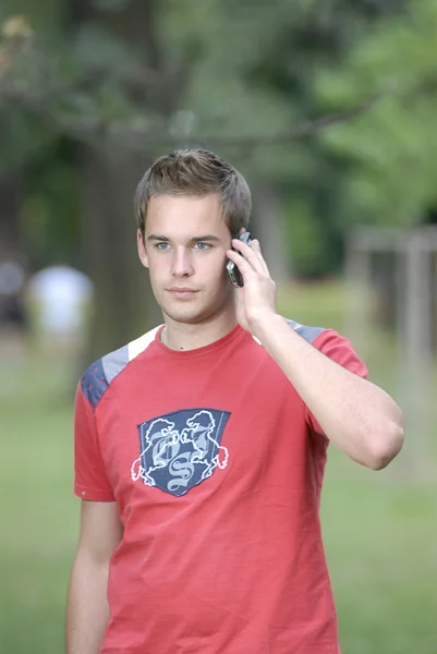 Young man talking on phone — Stock Photo, Image