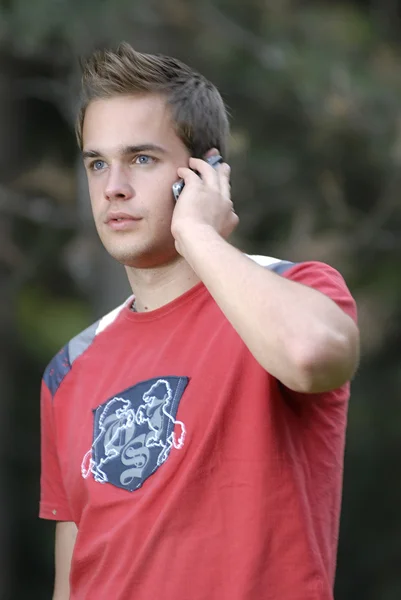 Young man talking on phone — Stock Photo, Image