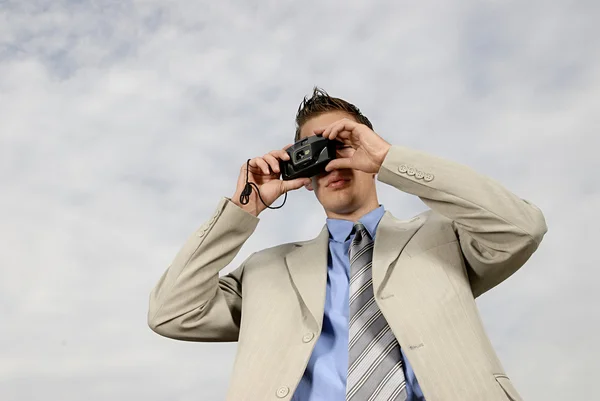 Stock image Young businessman with camera