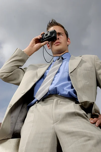 stock image Young businessman with camera