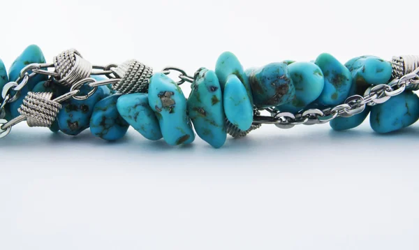 Turquoise stones and silver chain — Stock Photo, Image