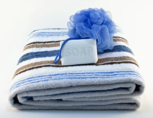 Towel with soap and sponge — Stock Photo, Image