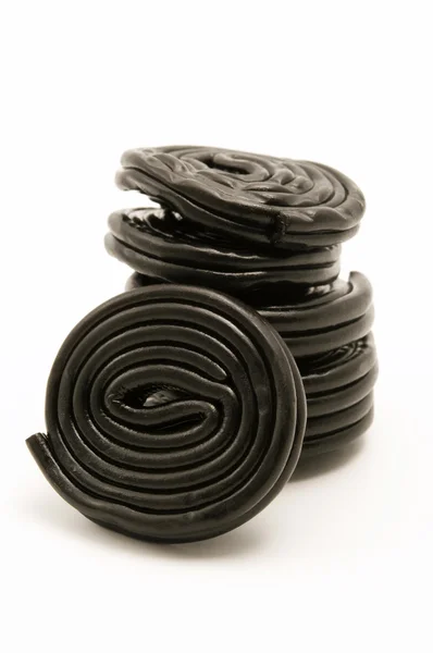 Чёрные лакричные колеса — стоковое фото