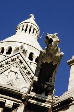 Gargoyle of the Sacre Coeur Basilica in Paris, France clipart