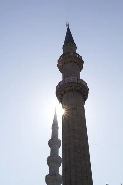 Minaret against sun — Stock Photo, Image