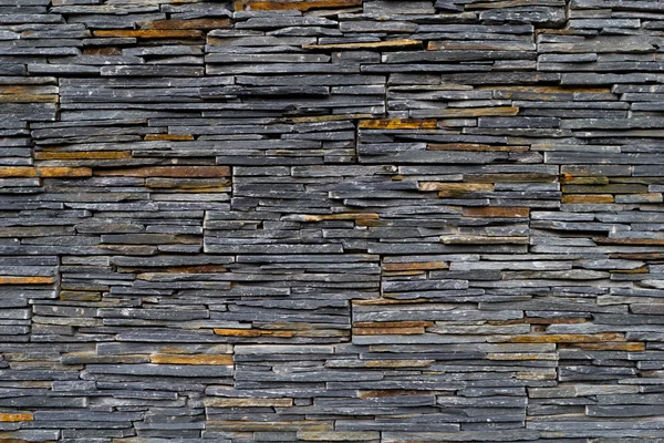 Texture of a wall with flat stones — Stock Photo, Image