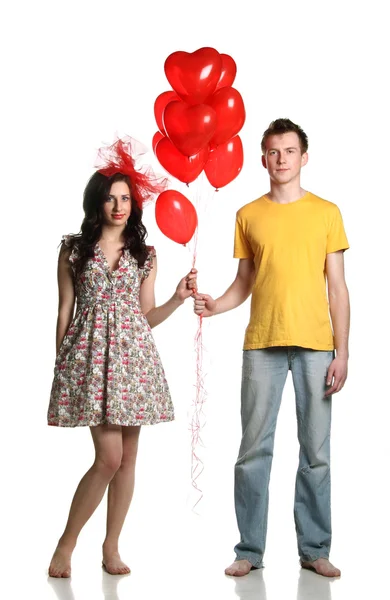 Pojke och flicka med ballonger Stockbild
