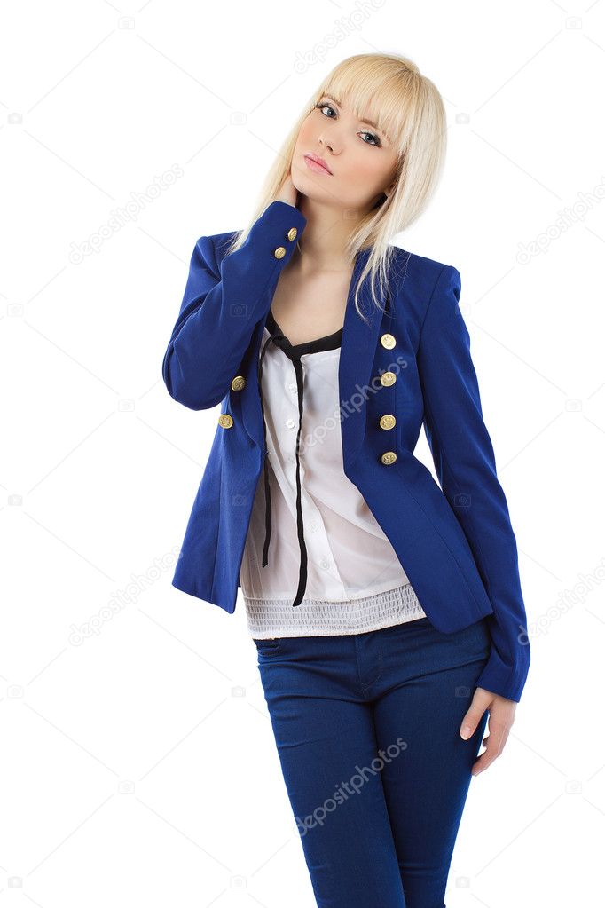 Beautiful young blonde girl in blue pants and jacket posing