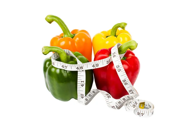 Fresh bell peppers all colors in measuring tape — Stock Photo, Image