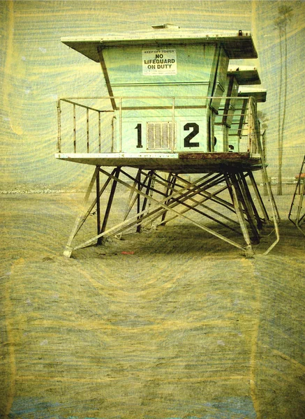 stock image Aged lifeguard tower on beach