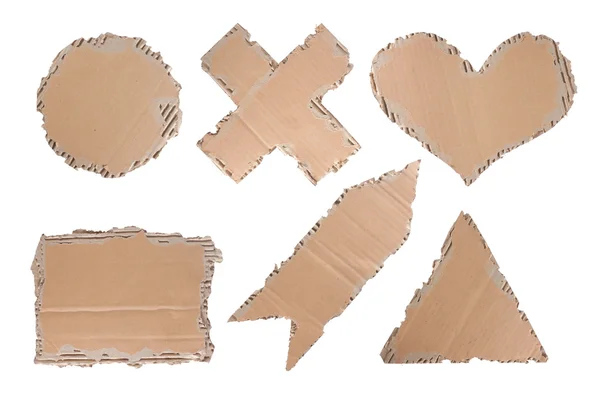 Cardboard with heart, circle, triangle, cross and arrow shape — Stock Photo, Image