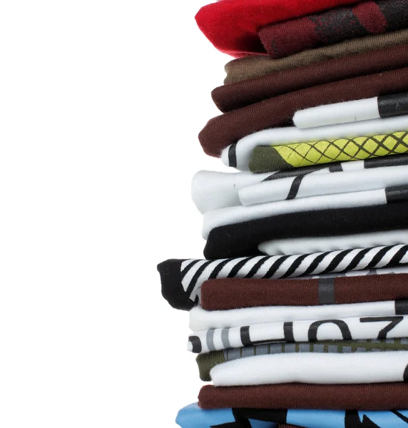 Pilha de t-shirt e roupas — Fotografia de Stock