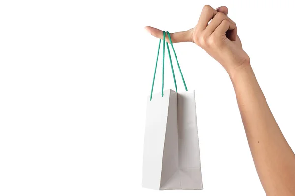 Mão segurando saco de papel isolado sobre branco — Fotografia de Stock