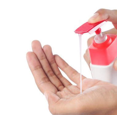 Female hands using hand sanitizer clipart