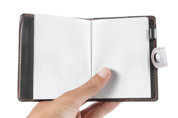 Hand holding a notebook — Zdjęcie stockowe