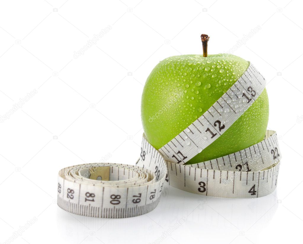 Fresh apple with measuring tape