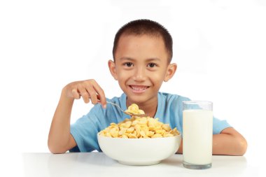 Kid's love to having breakfast with milk againts white backgroun clipart