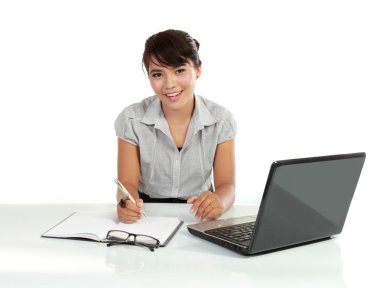 Young business woman working with laptop clipart