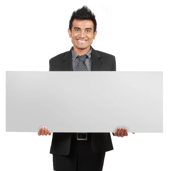 Hombre de negocios guapo sosteniendo un cartel en blanco — Foto de Stock