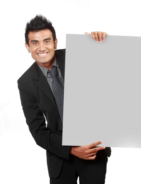 Young Businessman holding a blank sign — Stock Photo, Image