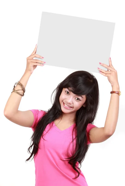 Portrait of a cute young woman holding a blank card — Stock Photo, Image