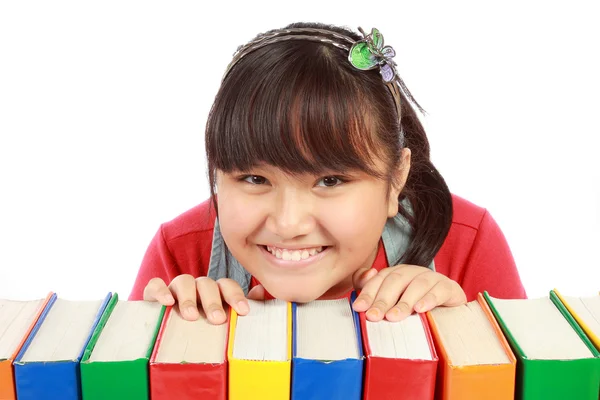 Klein meisje met boeken — Stockfoto