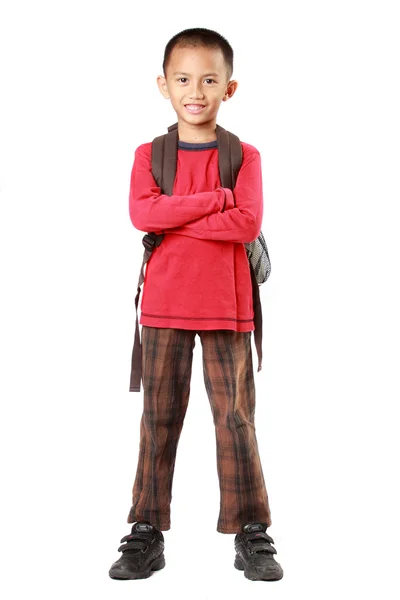 Portrait of boy with backpack smiling against white — Stock Photo, Image