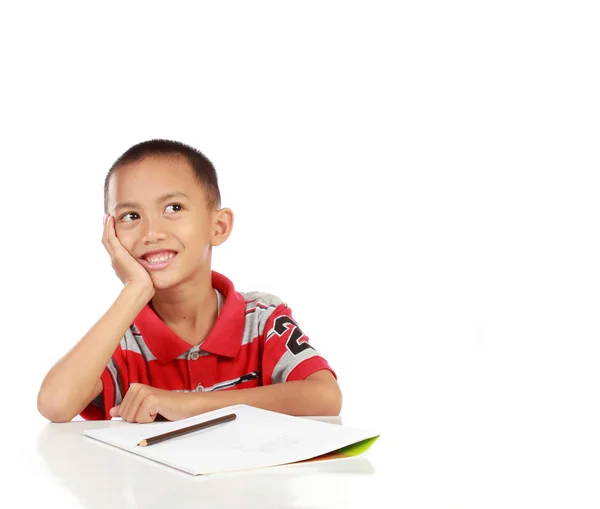 Portrait of little boy thinking and look up to copy space — Stock Photo, Image
