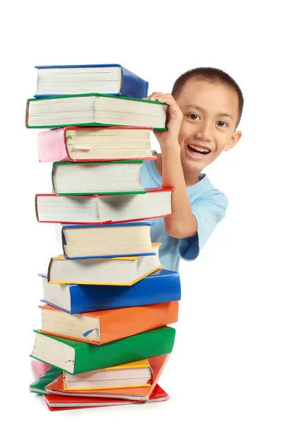 Pilha de livro com linda criança por trás dele — Fotografia de Stock