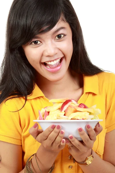 Young healthy girl having a fruit salad — Stock Photo, Image