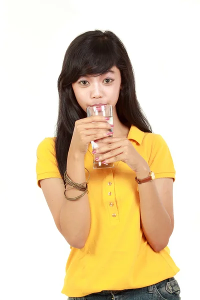 Young girl drinks water from glass — Stock Photo, Image