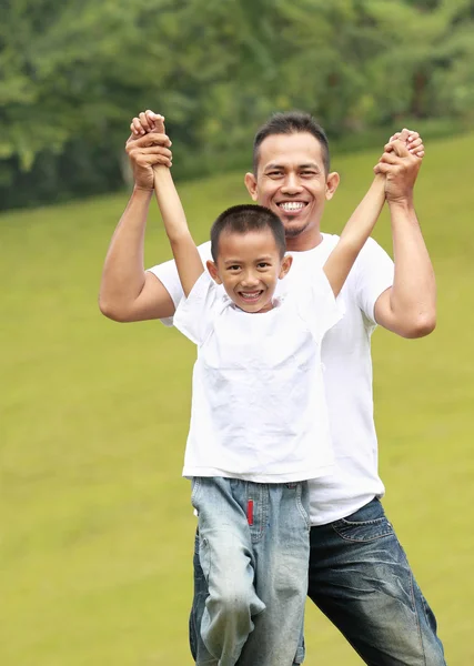 Man and young boy playing — Stock Photo, Image