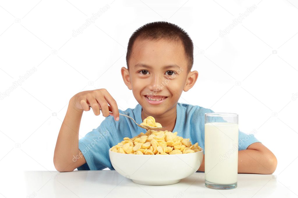 Kid's love to having breakfast with milk againts white backgroun