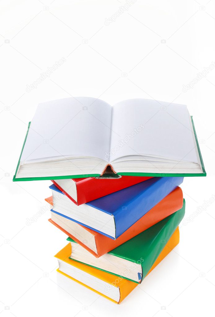 Stack of colorful books, one book wide open on top