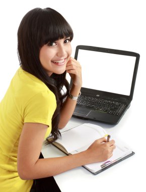 Female student with a laptop and notebooks clipart