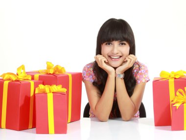 Young woman surrounded by packages clipart