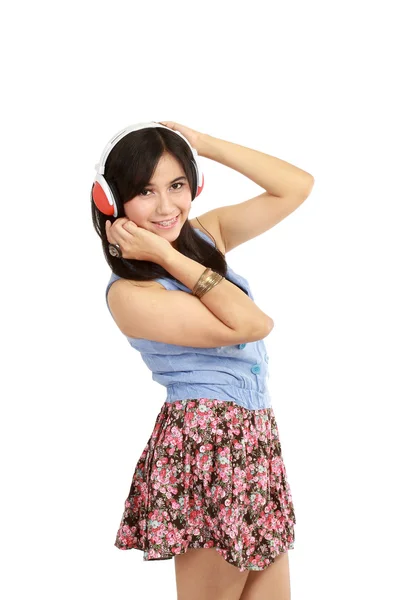 Beautiful girl enjoys listening music. — Stock Photo, Image